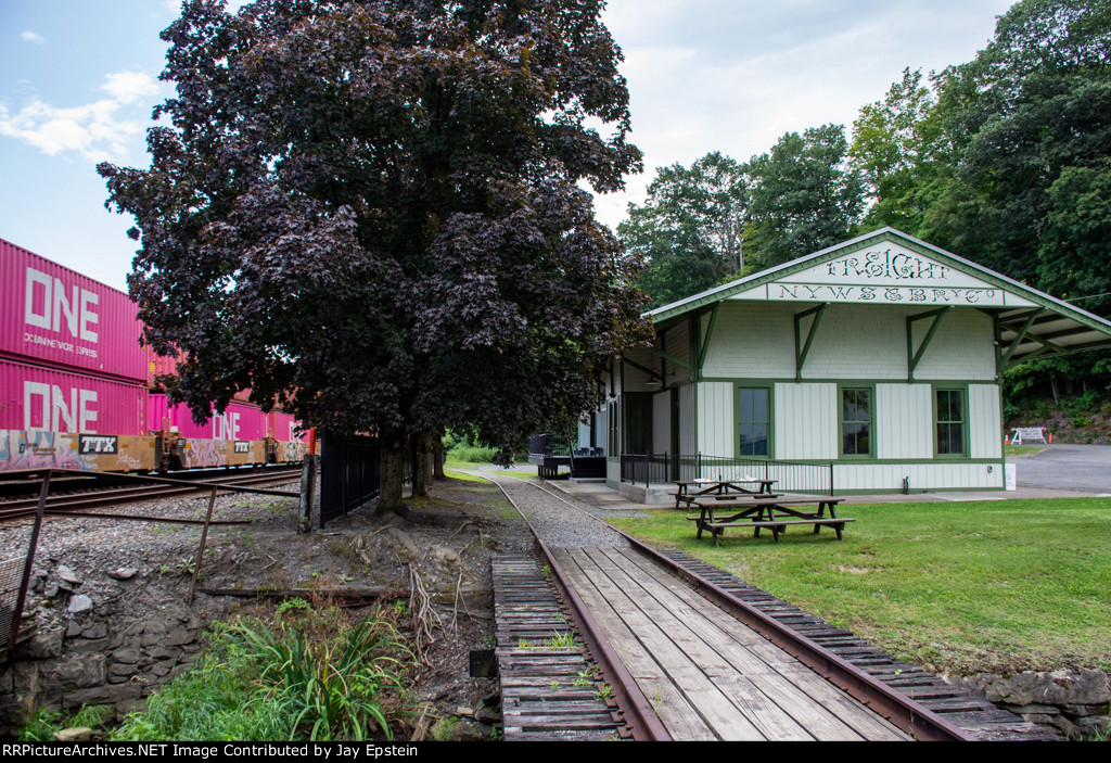 I162 rushes by the old freight depot in Milton 